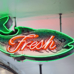 A neon sign of a fish.
