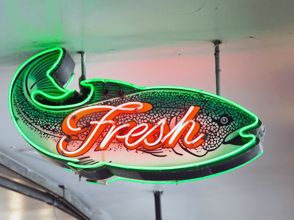 A neon sign of a fish.