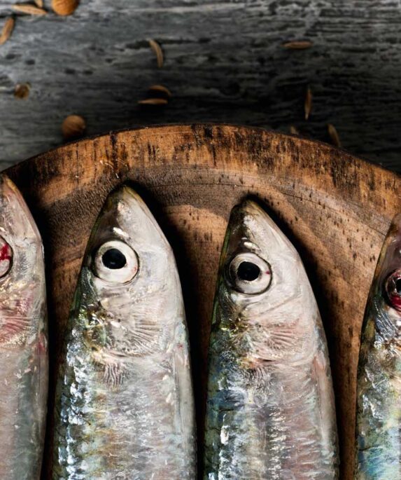 Sardines on a wooden board