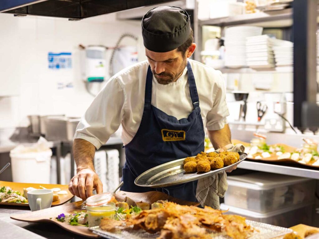 A chef preparing seafood.