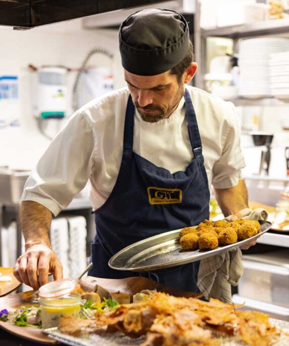 A chef preparing seafood.